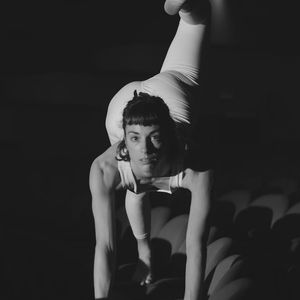 A person performing a gentle and deep stretch.